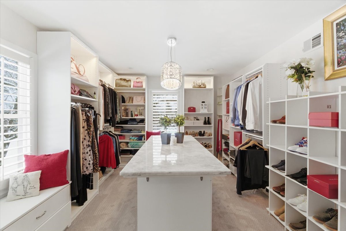 12 Crestview Lane Lake Barrington, IL 60010 - Photo 23 of 54 a view of walk in closet with clothes and shoes