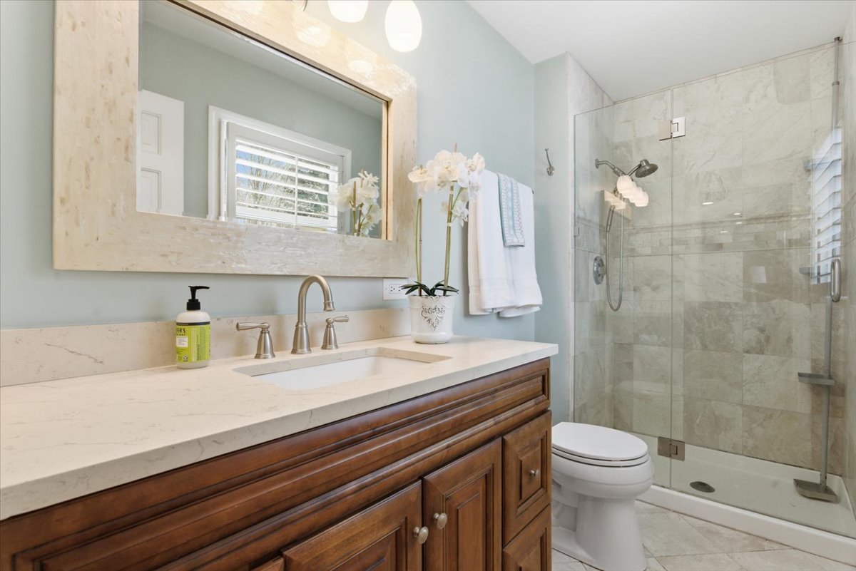 12 Crestview Lane Lake Barrington, IL 60010 - Photo 25 of 54 a bathroom with a sink a toilet and shower