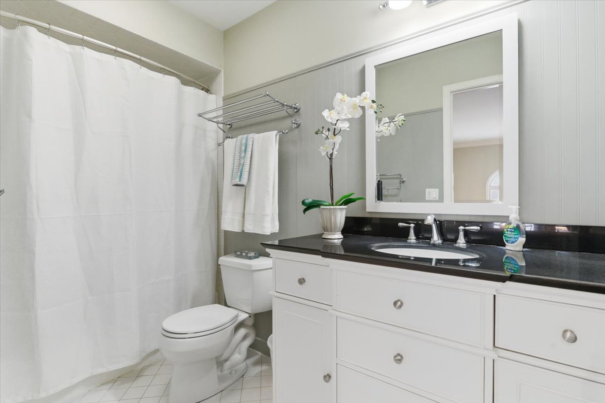 12 Crestview Lane Lake Barrington, IL 60010 - Photo 27 of 54 a bathroom with a granite countertop sink a toilet and a mirror