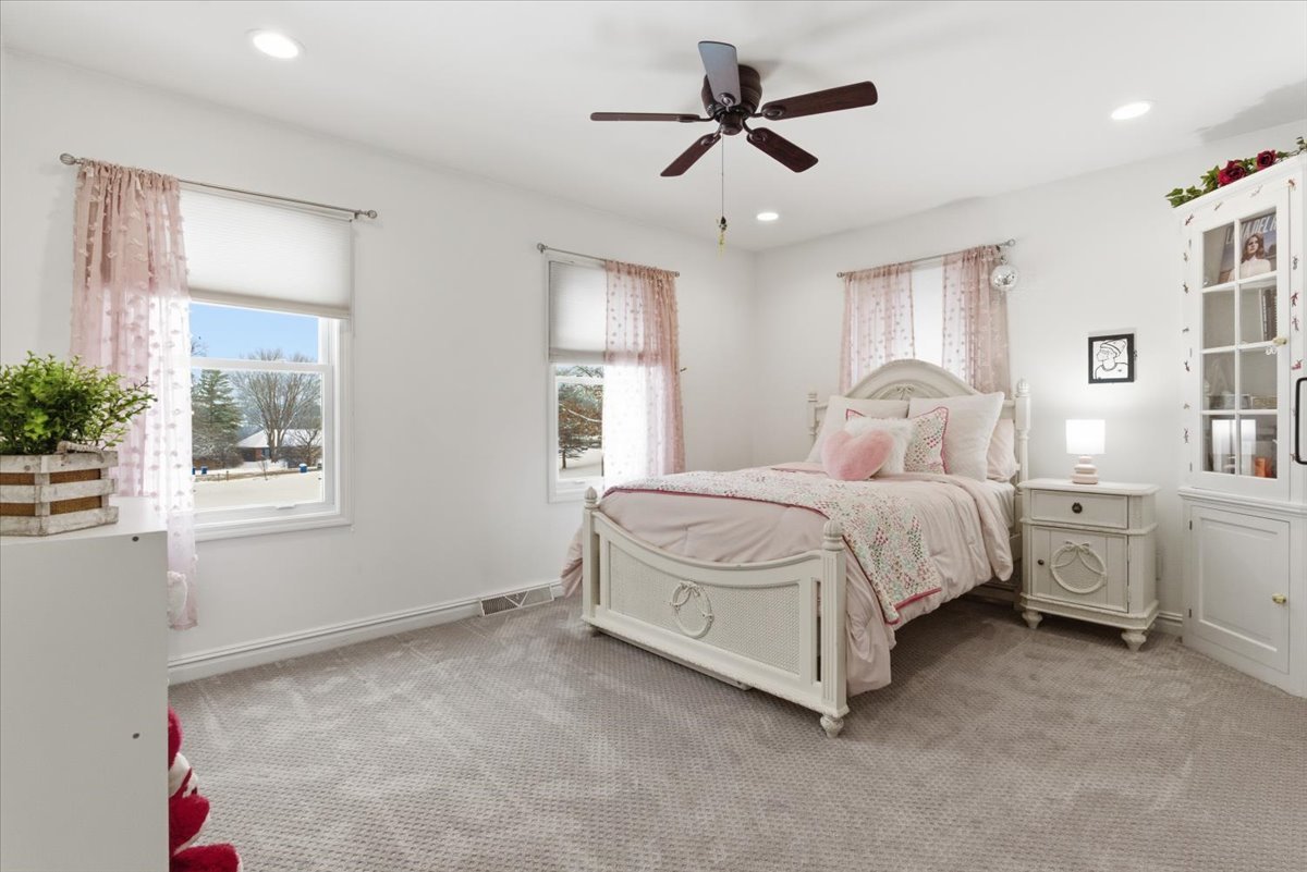 12 Crestview Lane Lake Barrington, IL 60010 - Photo 29 of 54 a bedroom with a large bed and a chandelier