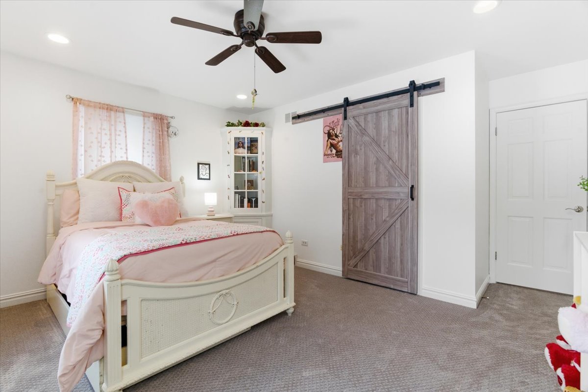 12 Crestview Lane Lake Barrington, IL 60010 - Photo 30 of 54 a bedroom with a bed and a ceiling fan