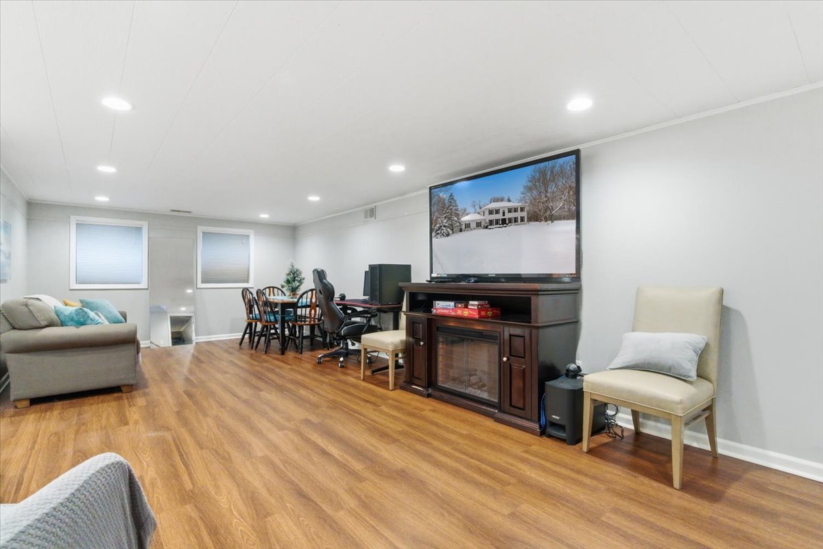 12 Crestview Lane Lake Barrington, IL 60010 - Photo 32 of 54 a living room with furniture and a dining table with wooden floor