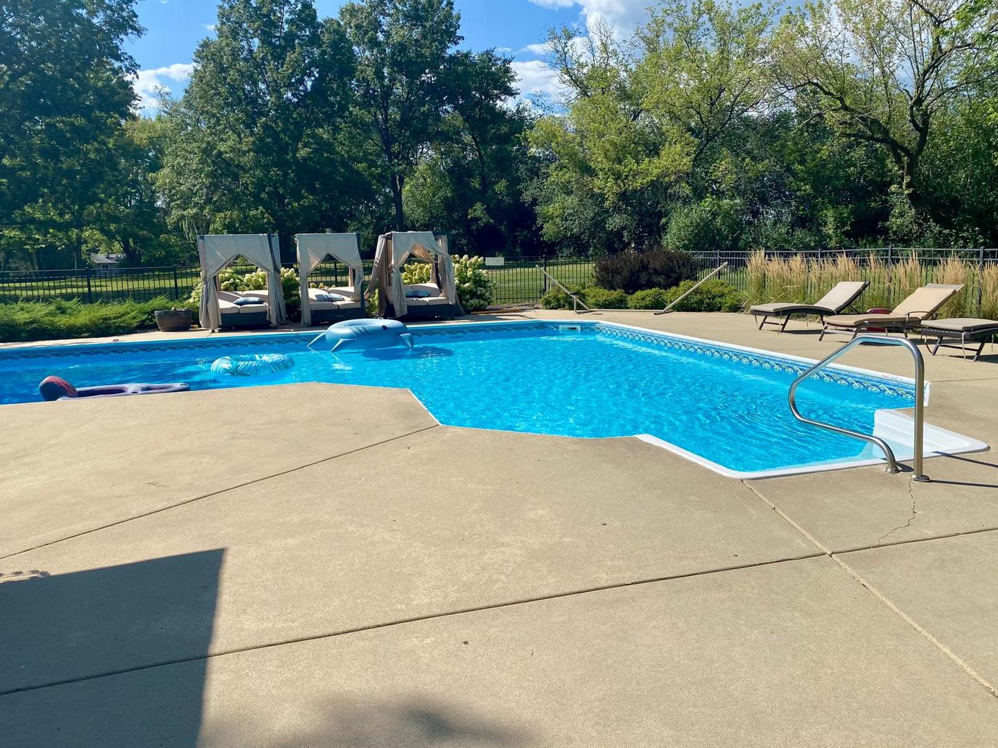 12 Crestview Lane Lake Barrington, IL 60010 - Photo 40 of 54 a view of a swimming pool with a lounge chairs