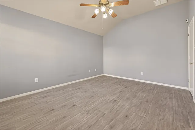 a spacious bathroom with a sink and a mirror