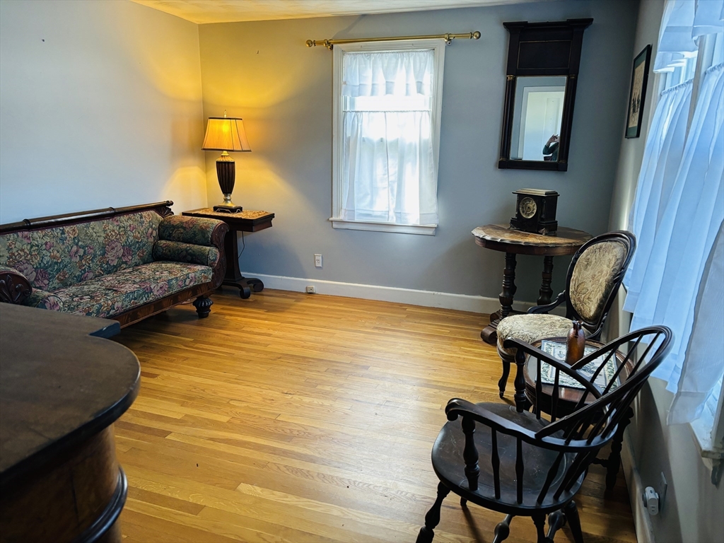 75 Powell Avenue Springfield, MA 01118 - Photo 13 of 25 a living room with furniture and a window