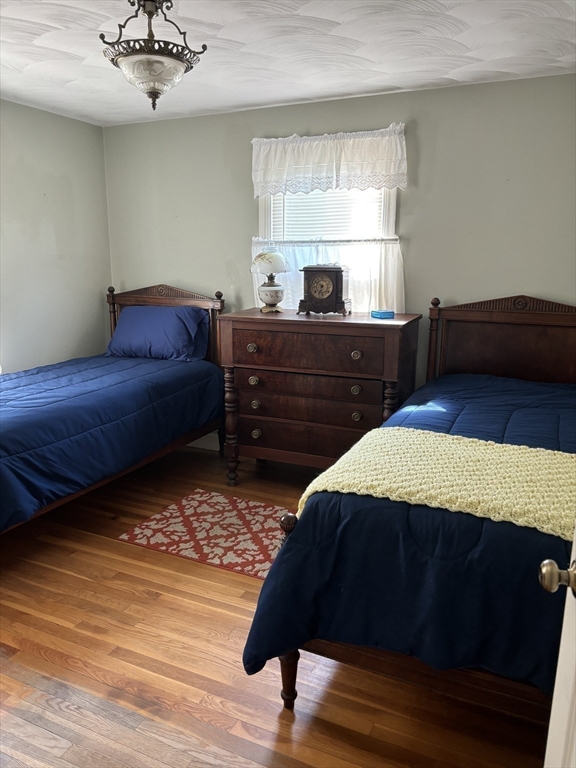 75 Powell Avenue Springfield, MA 01118 - Photo 18 of 25 a bed room with a bed and a dresser