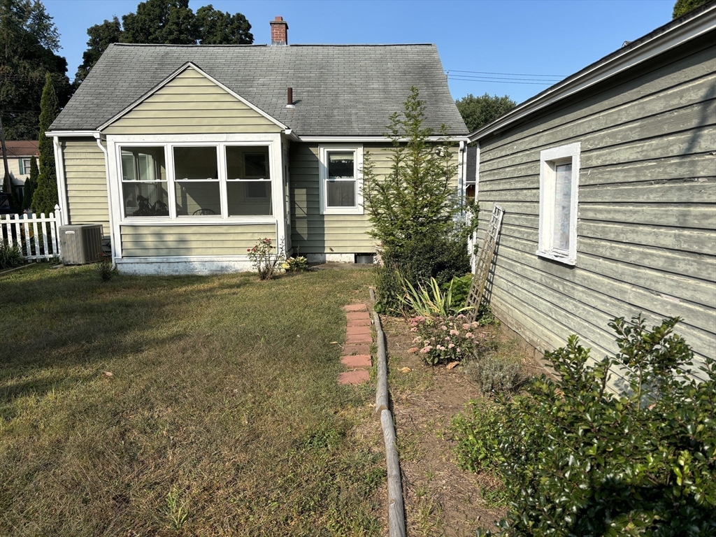 75 Powell Avenue Springfield, MA 01118 - Photo 2 of 25 a view of a house with a yard