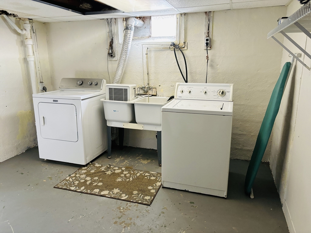 75 Powell Avenue Springfield, MA 01118 - Photo 22 of 25 a utility room with dryer and washer