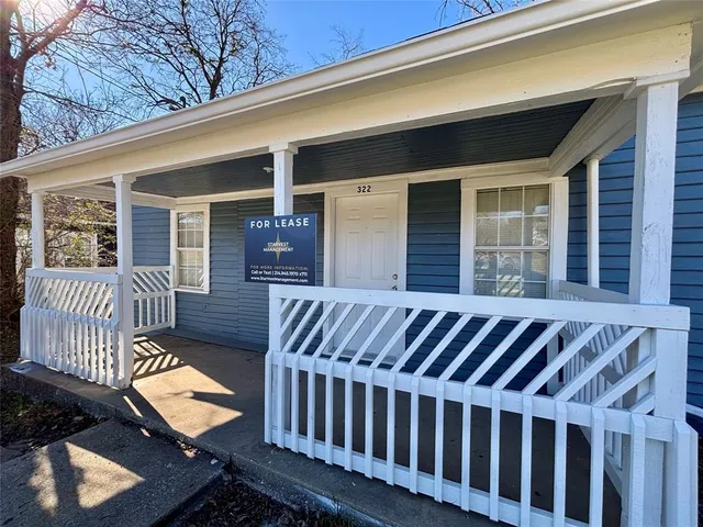 a view of a patio with a table and chairs