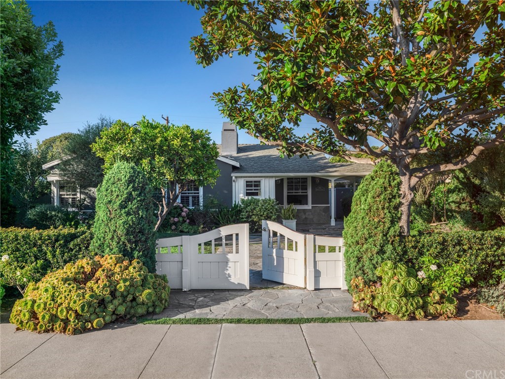 front view of a house with a garden