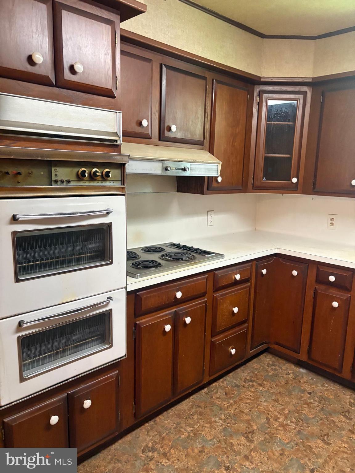 1500 Broadway Bethlehem, PA 18015 - Photo 12 of 43 a kitchen with granite countertop a stove and cabinets