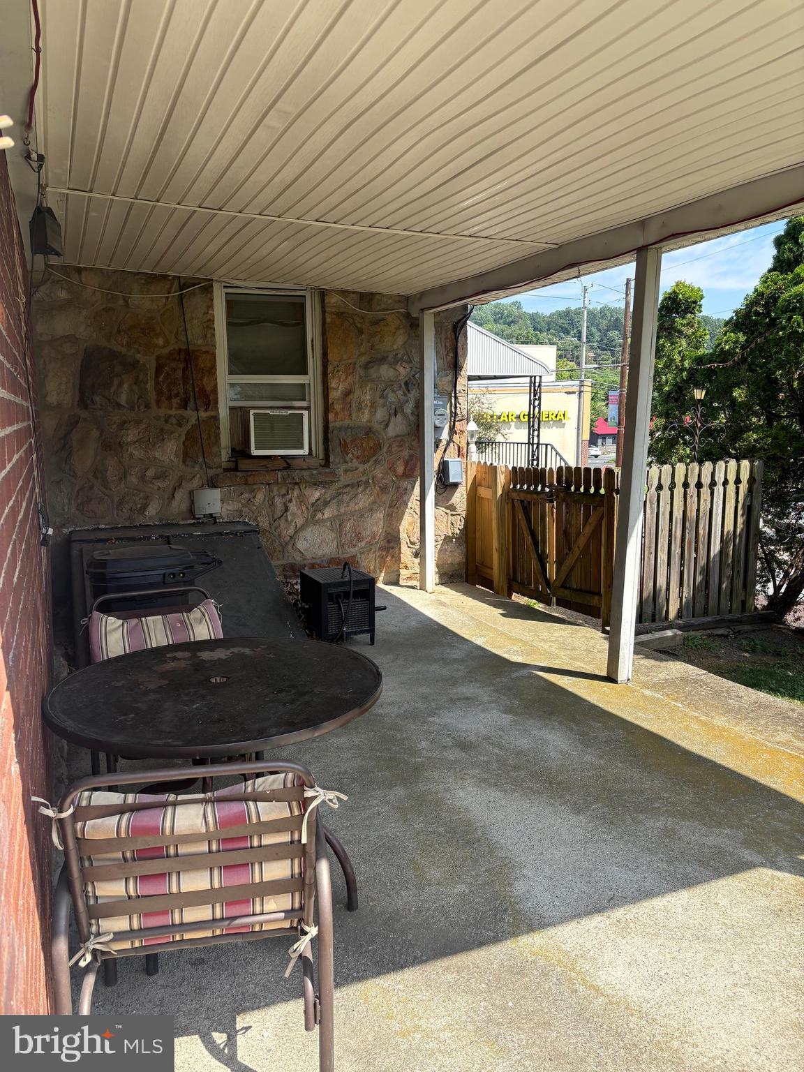 1500 Broadway Bethlehem, PA 18015 - Photo 4 of 43 a living room with furniture a flat screen tv and floor to ceiling window