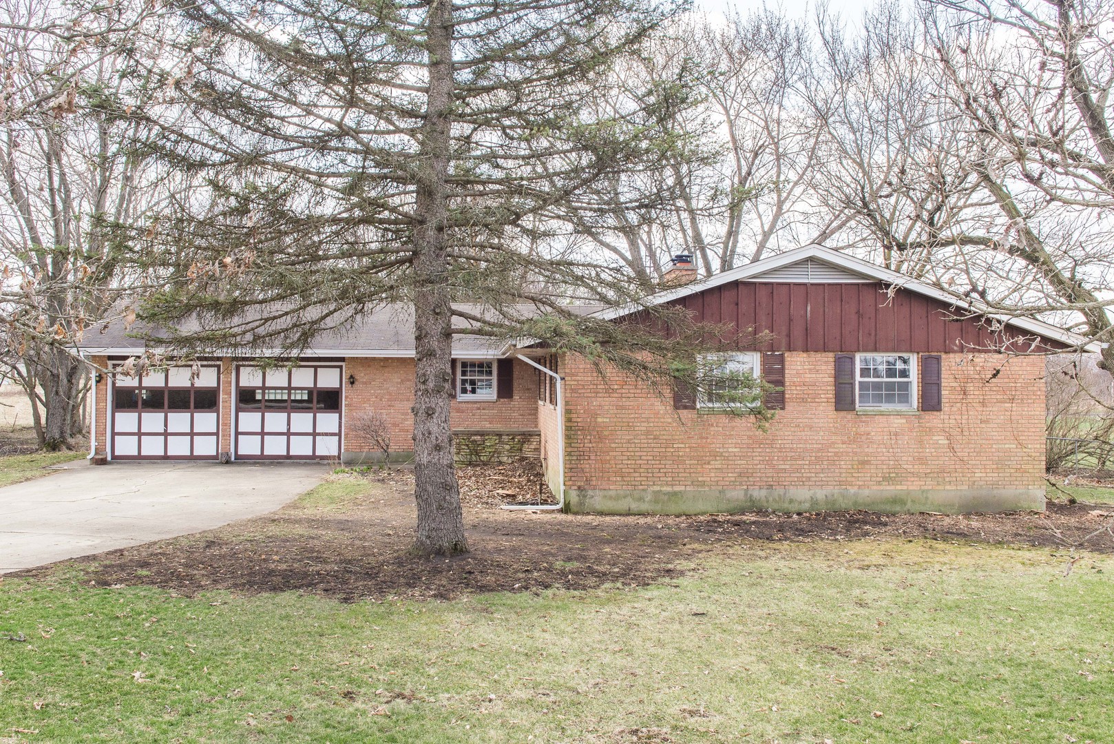 16118 Quigley Road Sycamore, IL 60178 - Photo 3 of 32 a front view of house with yard and trees