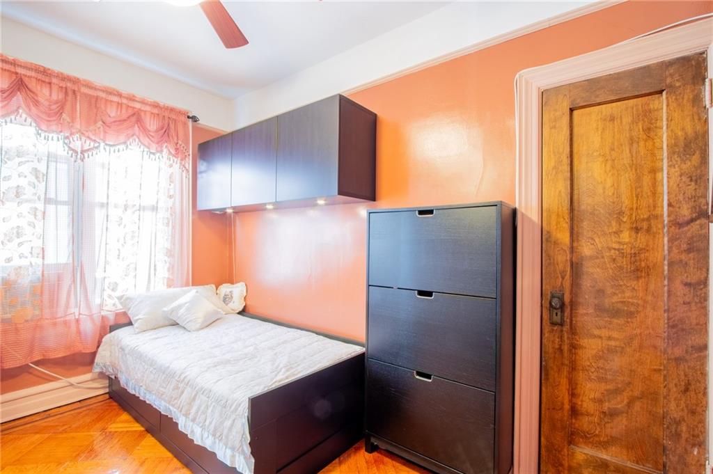 136 Bay Ridge Avenue Brooklyn, NY 11220 - Photo 11 of 48 a bedroom with a bed and a window