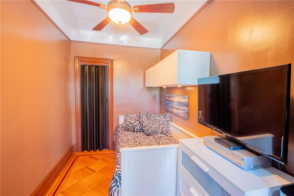 136 Bay Ridge Avenue Brooklyn, NY 11220 - Photo 15 of 48 a room with a bed and a flat screen tv