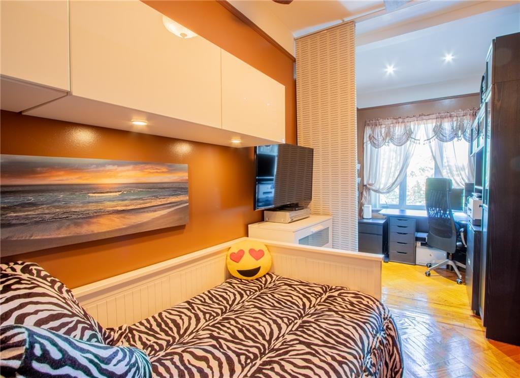 136 Bay Ridge Avenue Brooklyn, NY 11220 - Photo 17 of 48 a bedroom with a bed and wooden floor