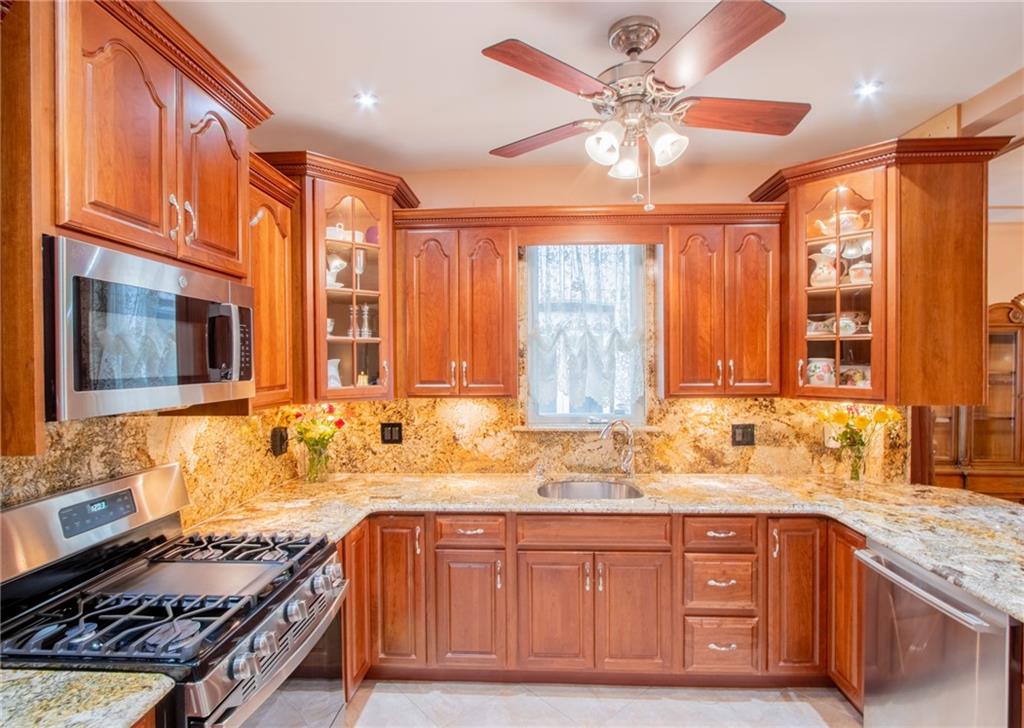 136 Bay Ridge Avenue Brooklyn, NY 11220 - Photo 23 of 48 a kitchen with granite countertop a stove and a sink