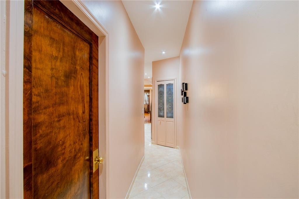 136 Bay Ridge Avenue Brooklyn, NY 11220 - Photo 32 of 48 a view of a hallway with wooden floor and closet