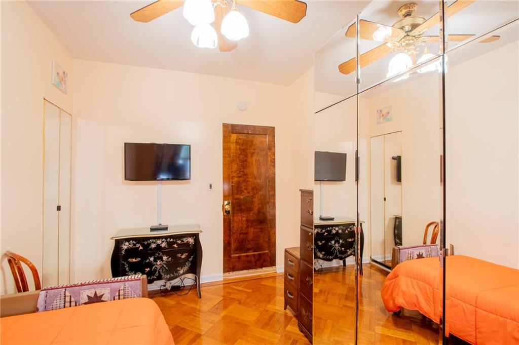 136 Bay Ridge Avenue Brooklyn, NY 11220 - Photo 33 of 48 a bedroom with a bed a flat screen tv and dresser