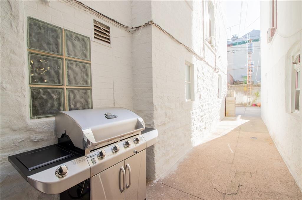 136 Bay Ridge Avenue Brooklyn, NY 11220 - Photo 40 of 48 a bathroom with a tub sink and a window