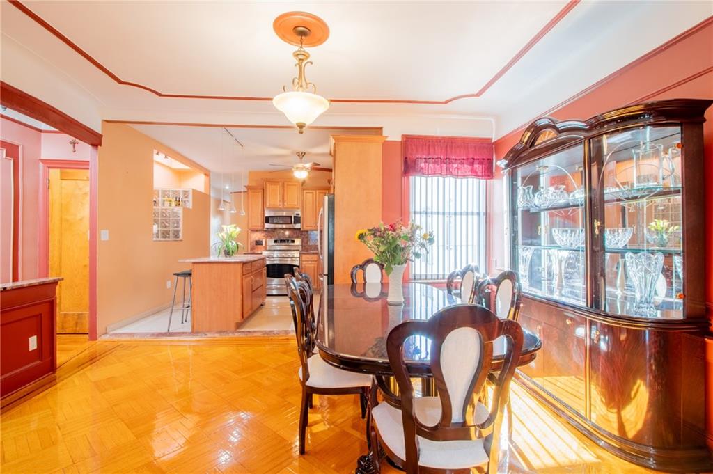 136 Bay Ridge Avenue Brooklyn, NY 11220 - Photo 4 of 48 a dining room with furniture and chandelier