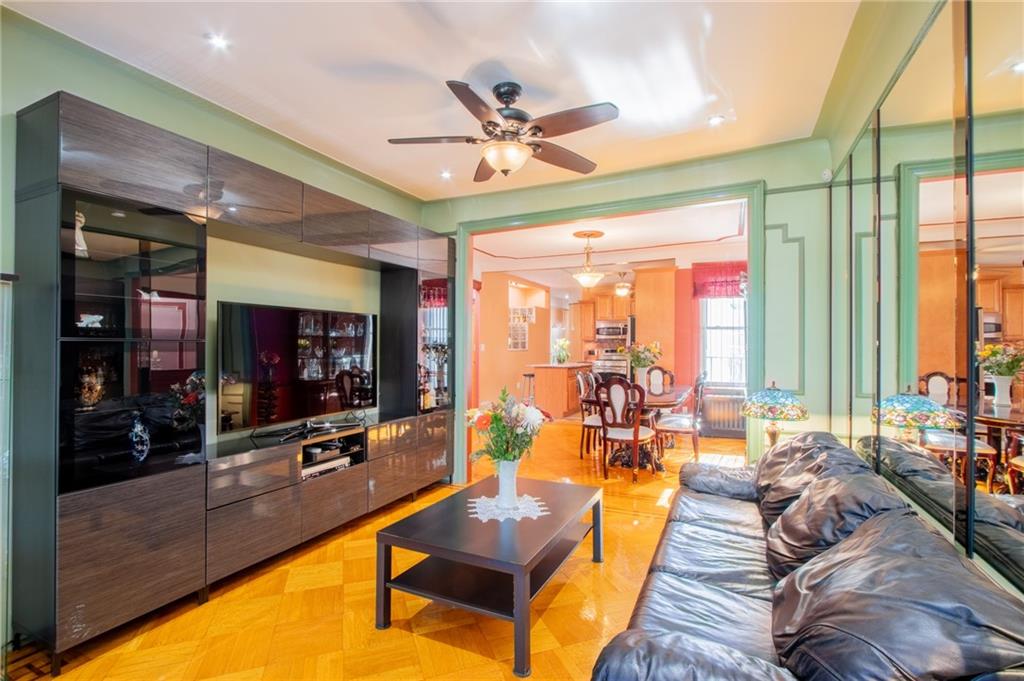 136 Bay Ridge Avenue Brooklyn, NY 11220 - Photo 5 of 48 a living room with furniture tv and a large window