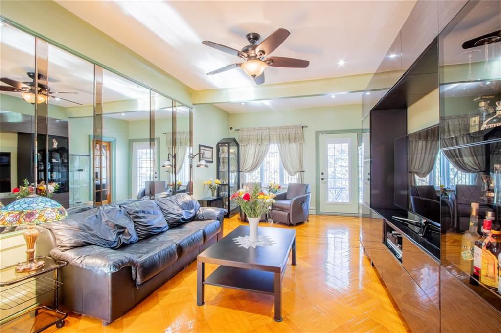 136 Bay Ridge Avenue Brooklyn, NY 11220 - Photo 7 of 48 a living room with furniture kitchen view and large windows