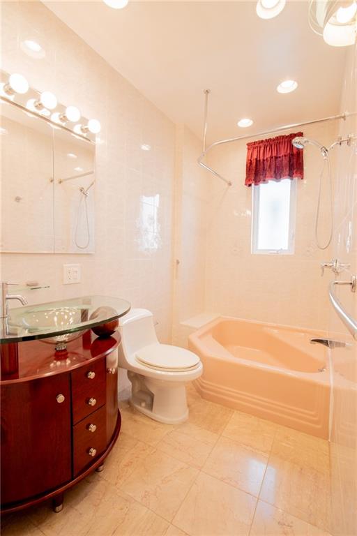 136 Bay Ridge Avenue Brooklyn, NY 11220 - Photo 8 of 48 a bathroom with a sink a toilet and shower