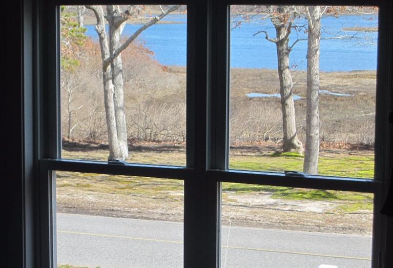 213 Monomoscoy Road Mashpee, MA 02649 - Photo 14 of 33 a view of a large window with an outdoor view