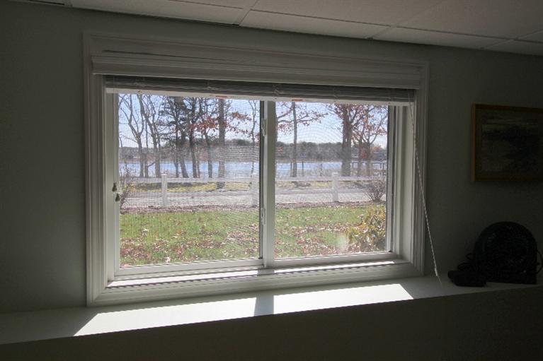 213 Monomoscoy Road Mashpee, MA 02649 - Photo 21 of 33 a view of a room that has a large window