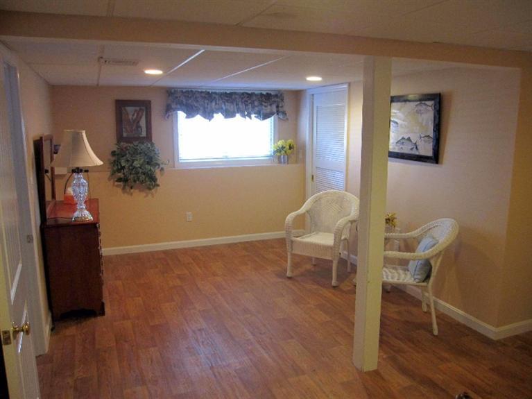 213 Monomoscoy Road Mashpee, MA 02649 - Photo 22 of 33 a workspace with wooden floor and a workspace