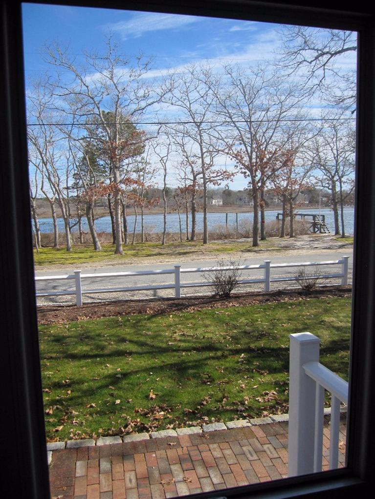 213 Monomoscoy Road Mashpee, MA 02649 - Photo 5 of 33 a view of a yard with an empty space