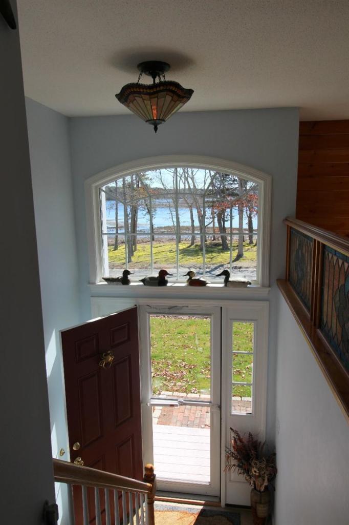213 Monomoscoy Road Mashpee, MA 02649 - Photo 6 of 33 a view of an entryway with a window