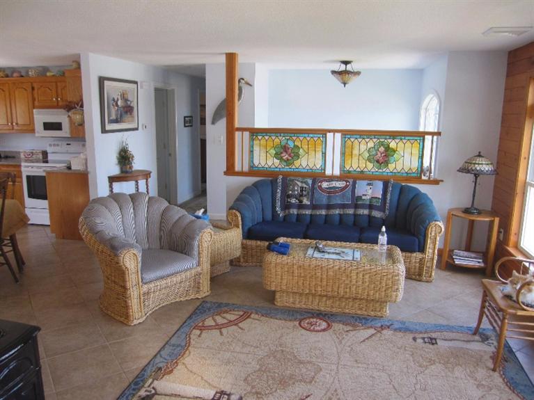 213 Monomoscoy Road Mashpee, MA 02649 - Photo 8 of 33 a living room with furniture and a window