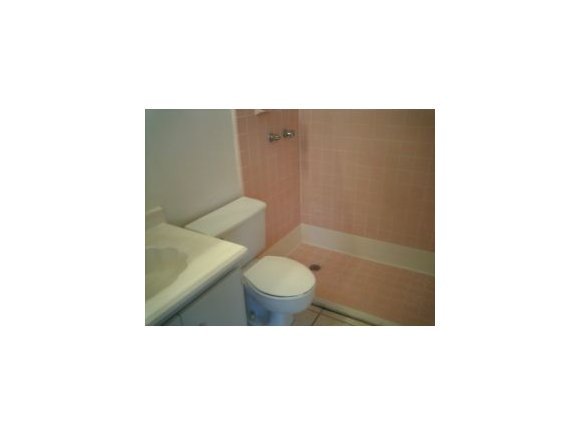 3291 Northeast Fairfax Palm Bay, FL 32905 - Photo 7 of 12 a bathroom with a toilet and a shower
