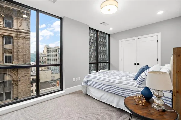 a bedroom with a bed and window