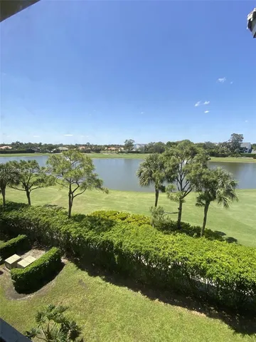 a view of a lake with a yard