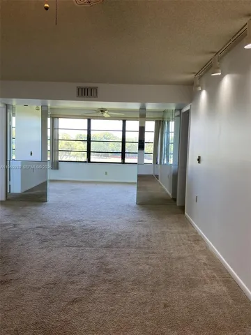 en empty room with windows and view