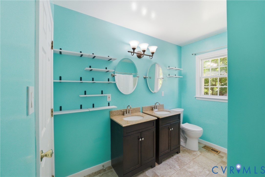2512 Brookforest Road Midlothian, VA 23112 - Photo 19 of 40 Bathroom featuring two dark wood-finish vanities w
