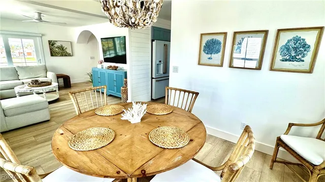 a dining room with furniture and wooden floor