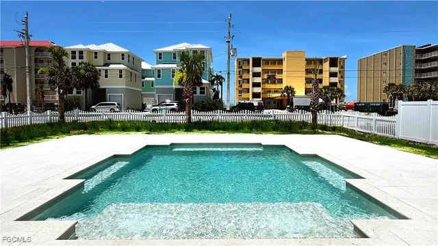 a view of multiple houses with a yard