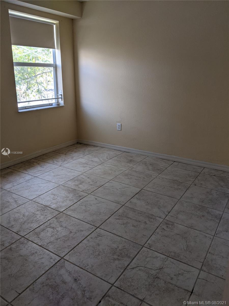 520 Southwest 5th Street, Unit 203 Miami, FL 33130 - Photo 9 of 51 an empty room with windows