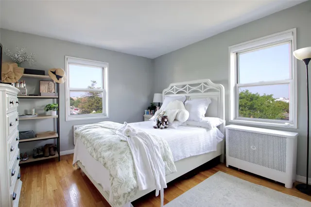 a bedroom with a bed and a view of bedroom