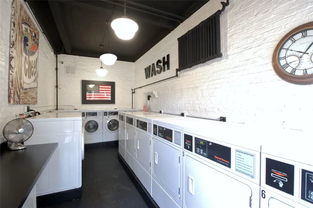 a kitchen with stainless steel appliances a stove a sink and a refrigerator
