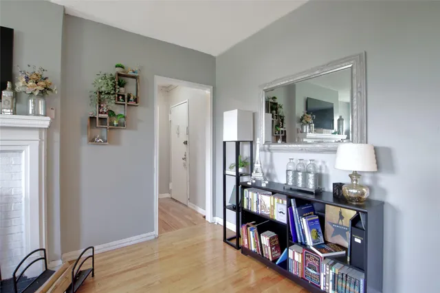 a view of an entryway with wooden floor