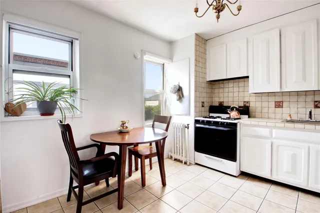 a kitchen with stainless steel appliances kitchen island granite countertop a sink and cabinets