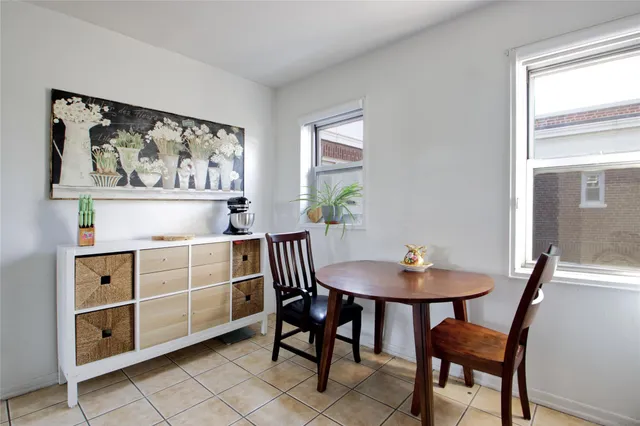 a view of a dining room with furniture and window