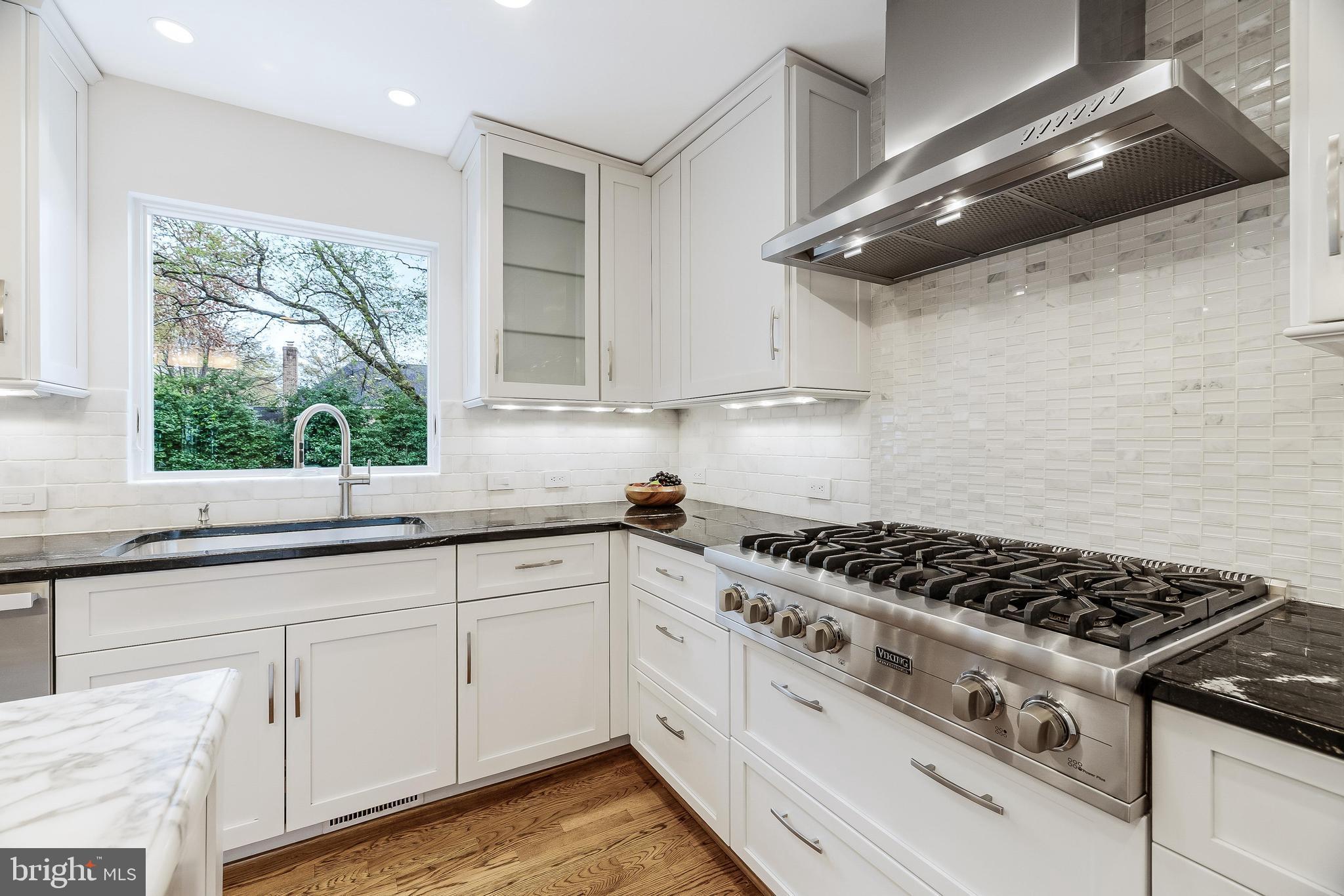 1205 Suffield Drive McLean, VA 22101 - Photo 17 of 76 a kitchen with granite countertop a stove and a sink