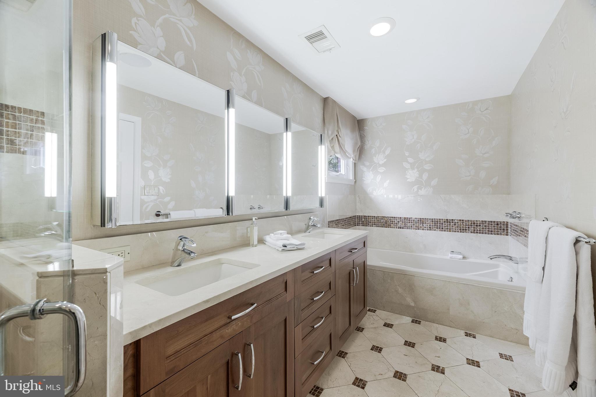 1205 Suffield Drive McLean, VA 22101 - Photo 40 of 76 a bathroom with a sink mirror toilet shower and bathtub