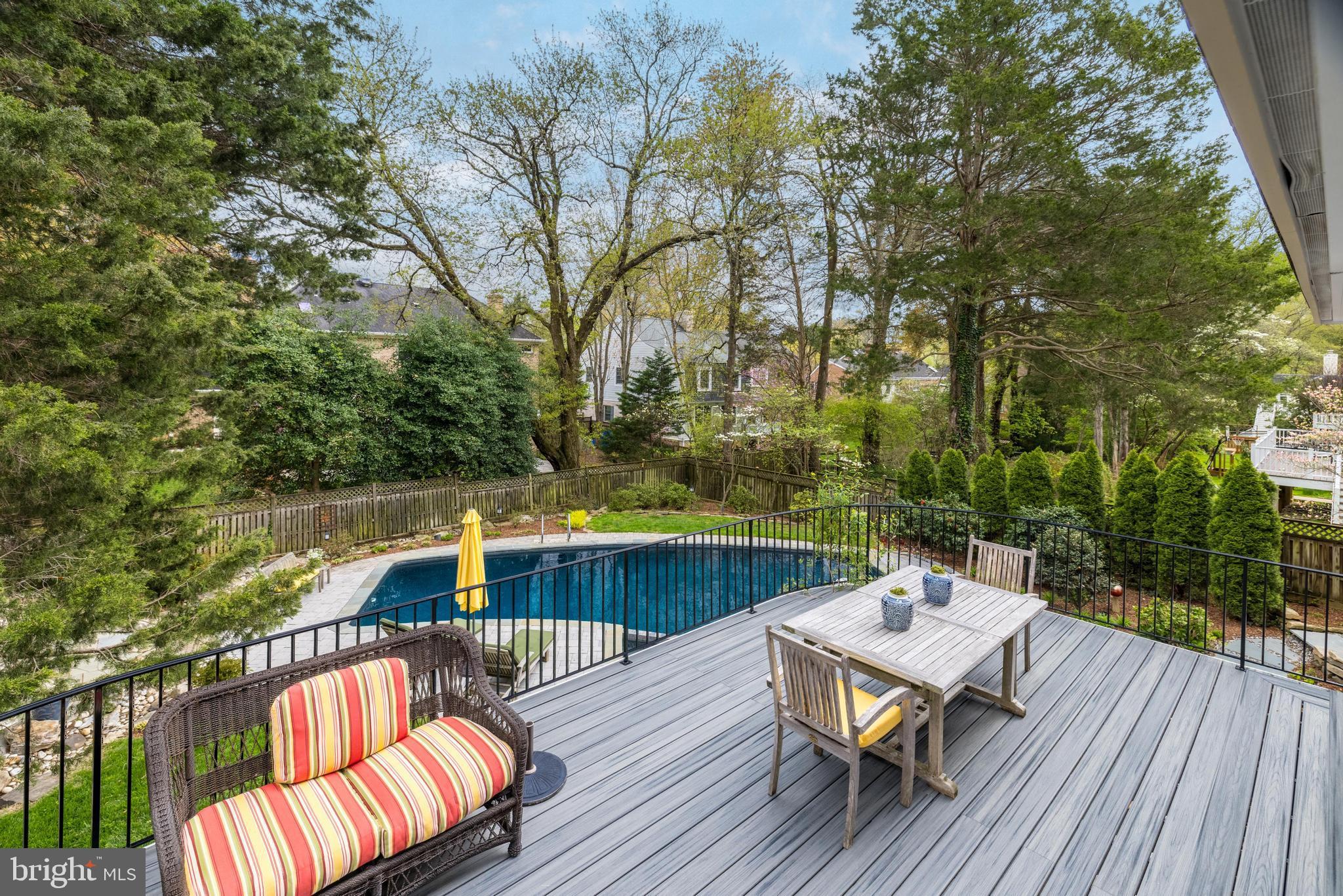 1205 Suffield Drive McLean, VA 22101 - Photo 69 of 76 a balcony with wooden floor table and chairs
